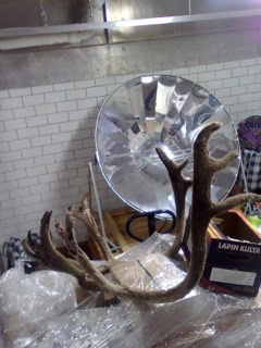 Antto's studio, with solar cooker and reindeer antlers