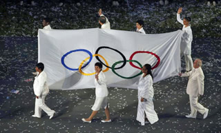 Sally Becker carrying the Olympic flag