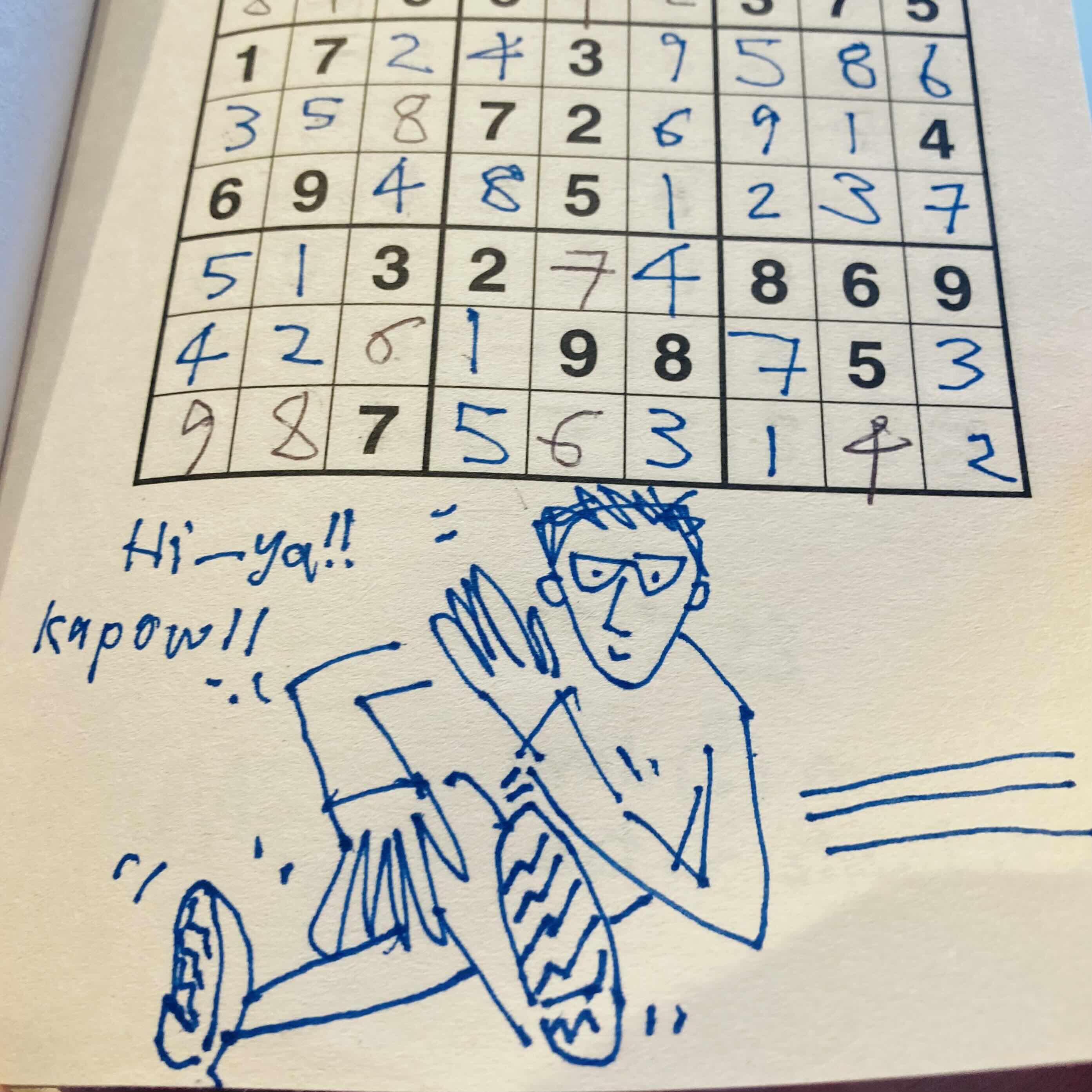 beneath a finished puzzle, a sketched Speccy Man comes flying towards the viewer in karate pose, with spoken 'Hi-yah! Kapow!' beneath a finished puzzle, a sketched Speccy Man comes flying towards the viewer in karate pose, with spoken 'Hi-yah! Kapow!'