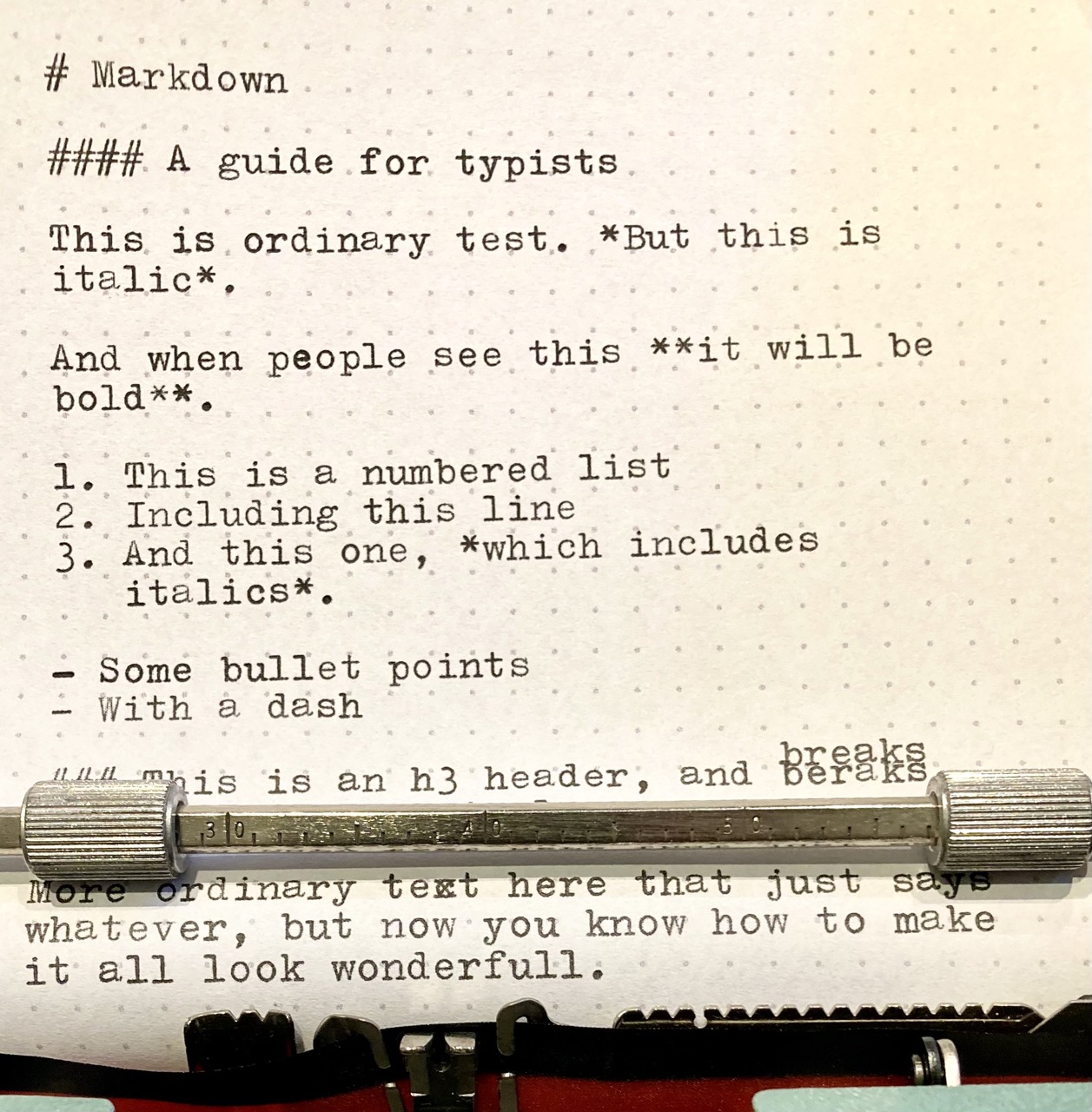 Text on a typewriter featuring Markdown code.