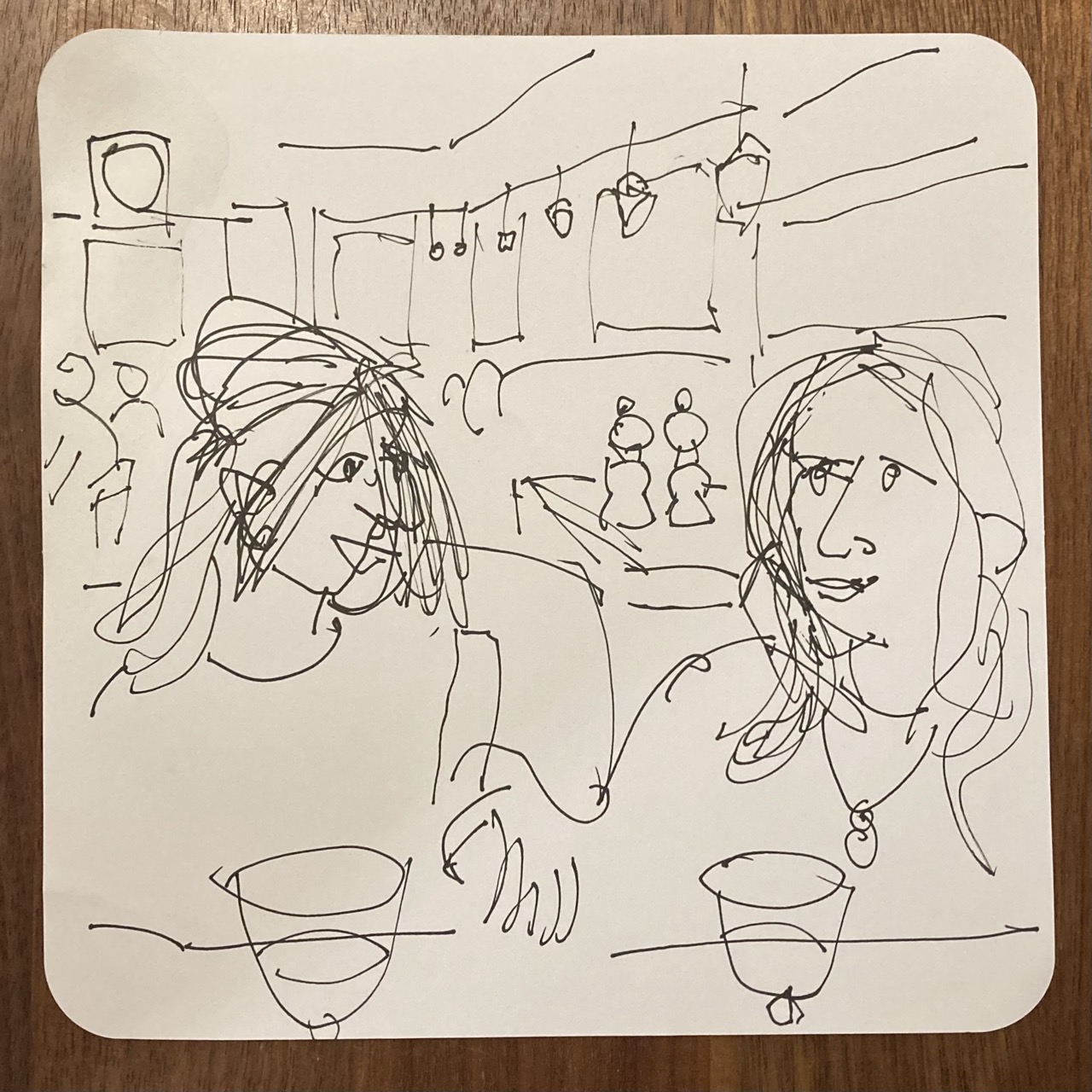 Line drawing of two women in a restaurant.