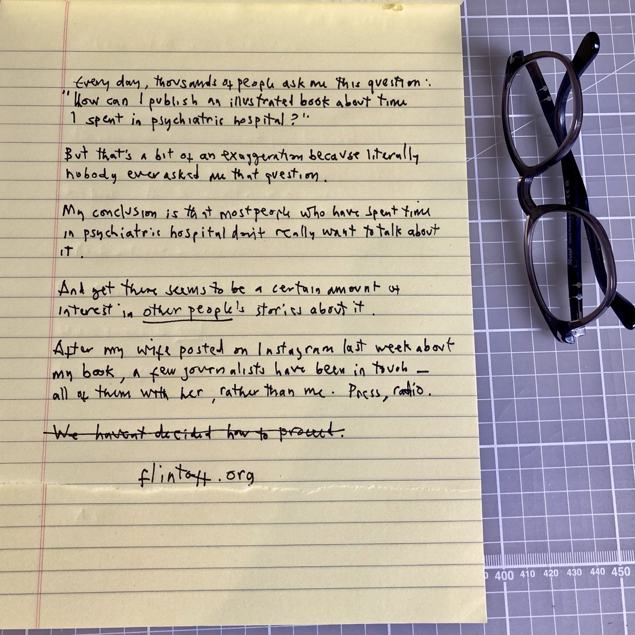 Handwritten text on lined yellow paper