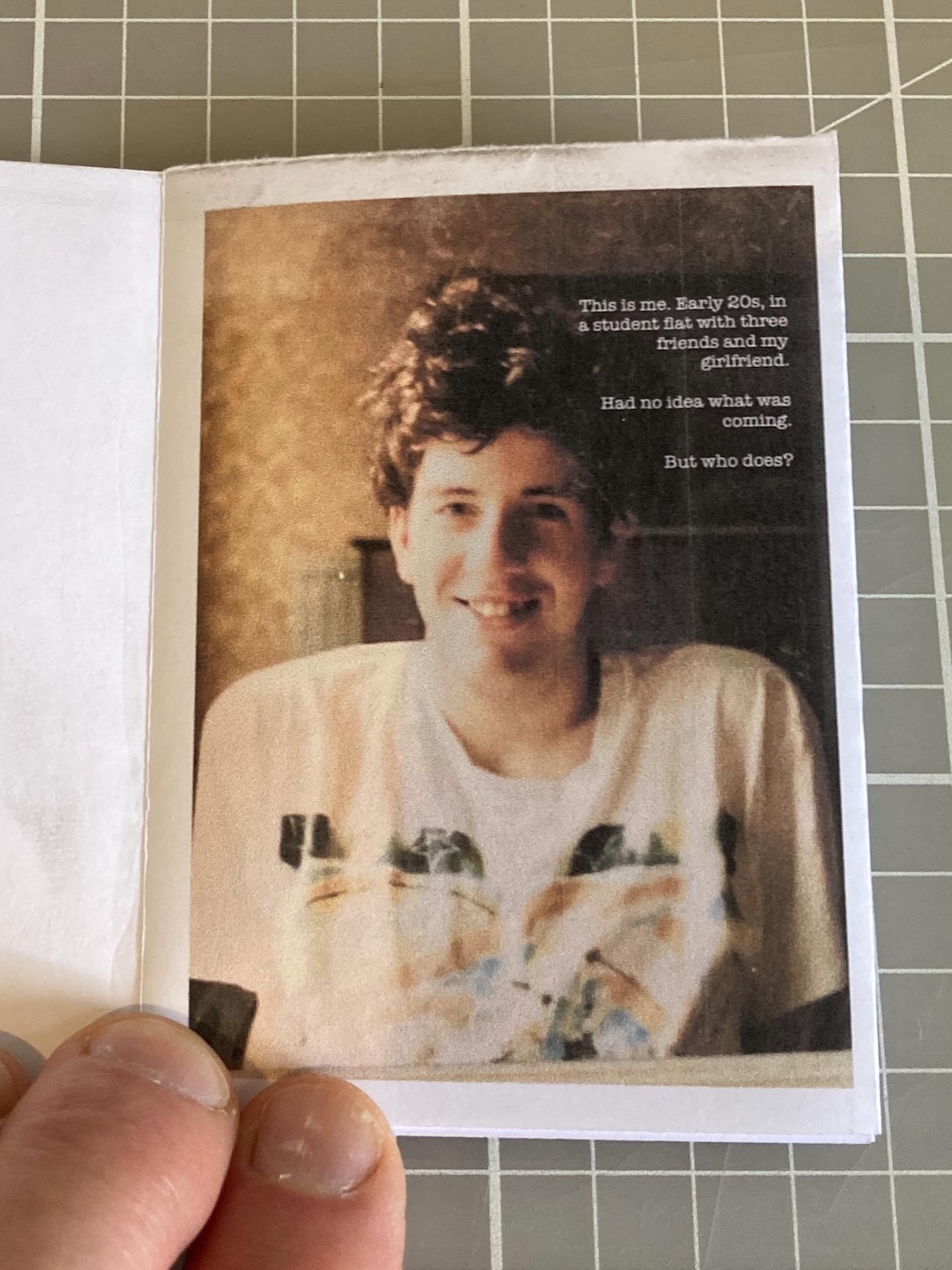 Opening spread shows a photo of a young man smiling. Opening spread shows a photo of a young man smiling.