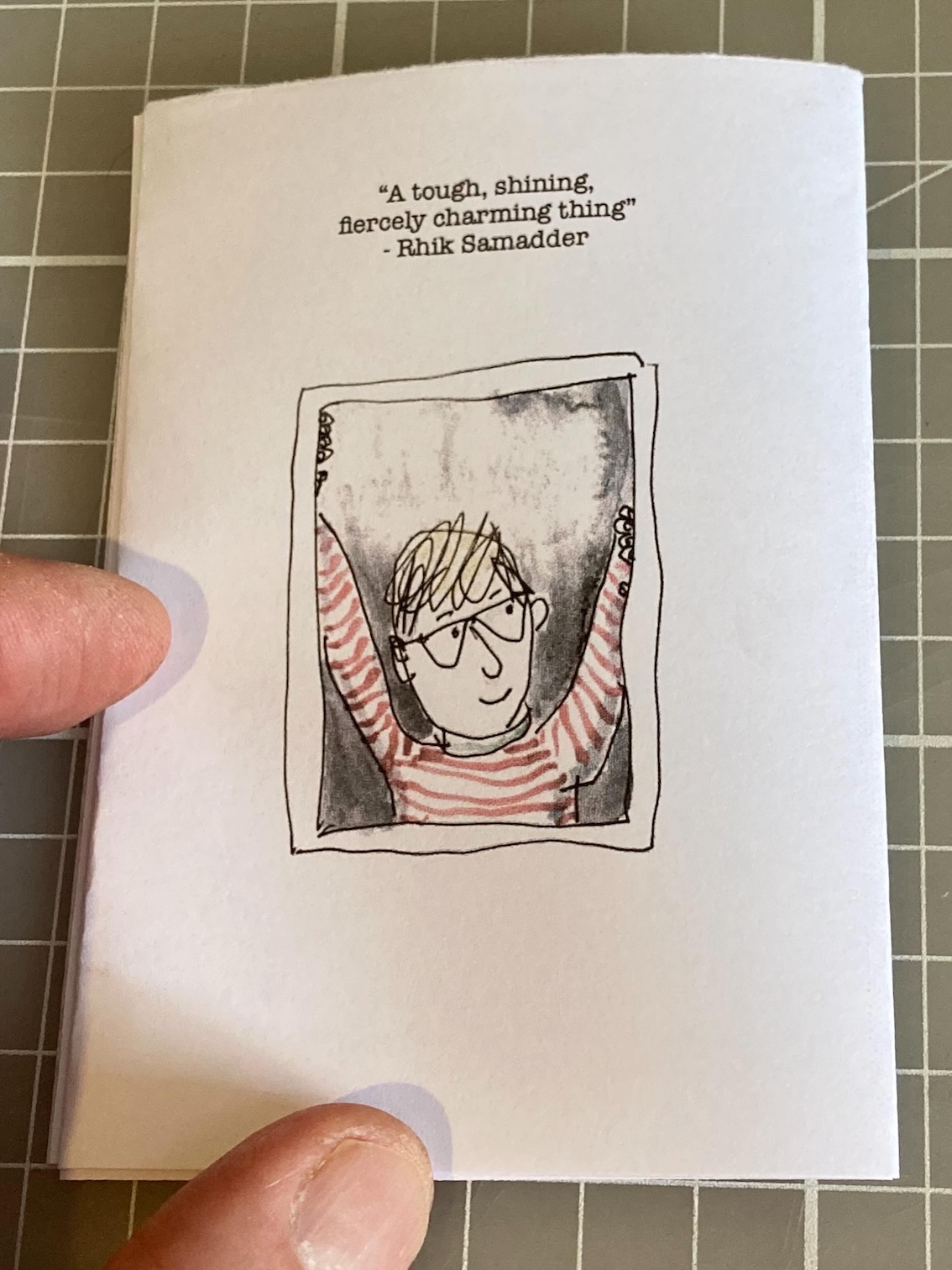 Back copy of the zine shows a speccy man looking out of a window cheerfully and a quote. Back copy of the zine shows a speccy man looking out of a window cheerfully and a quote.