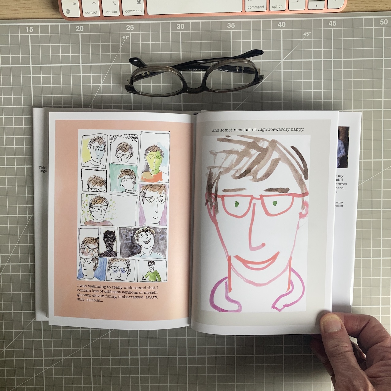 Hardback book held open mid-spread, showing the interior illustrations.