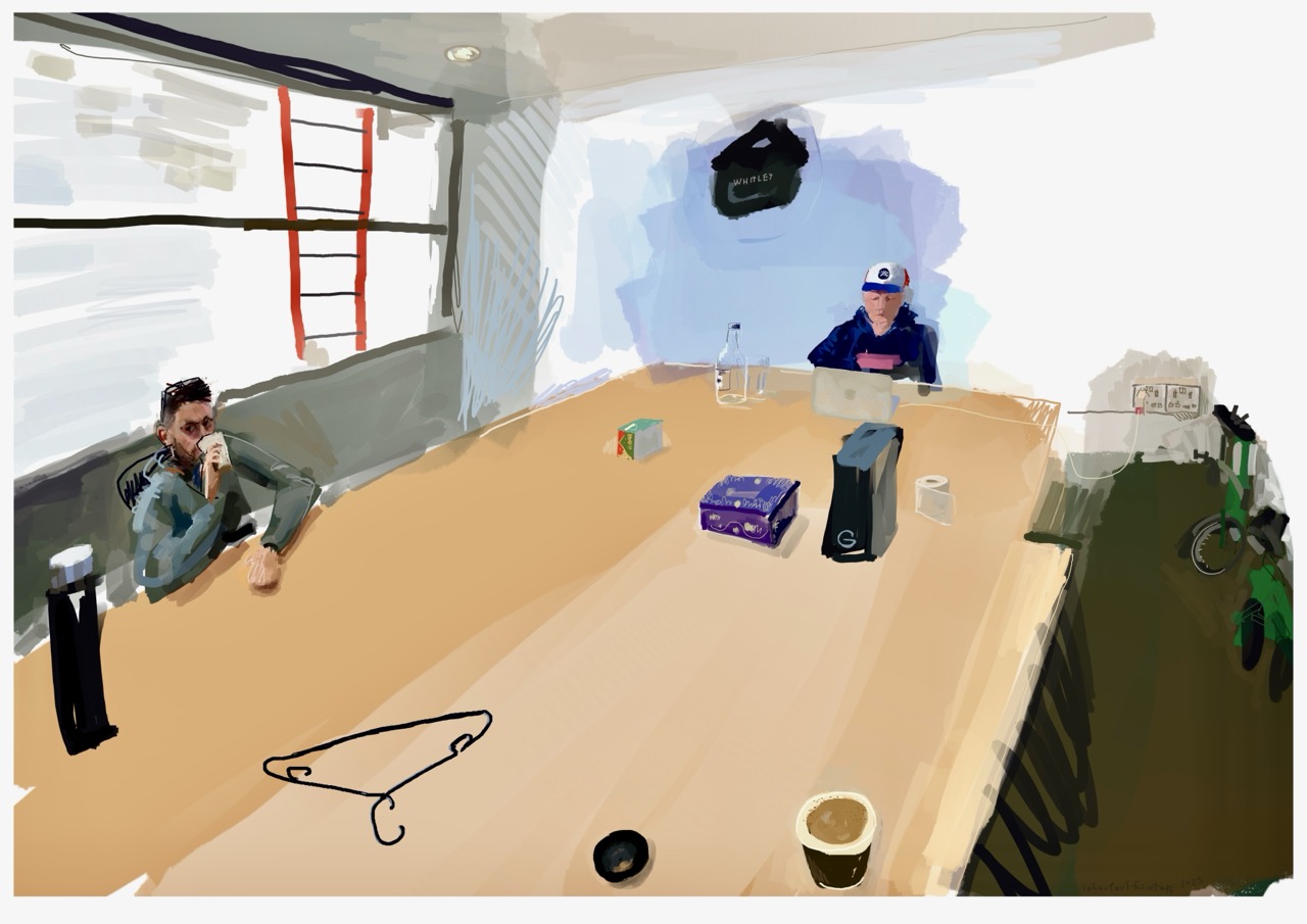 Joel Levack and Phil Tidy in an upstairs office at All Is Joy Soho, a shared table between them laden with a thermos, coffee cup, Lemsip, tin of chocolates, water bottle and glass, laptop, roll of loo paper, coat hanger and a small tech box; two green Bromptons with different handlebars parked nearby; through the window a red ladder Joel painted to match the tomatoes he grew in a rooftop planter for Soho Bloody Marys. Joel Levack and Phil Tidy in an upstairs office at All Is Joy Soho, a shared table between them laden with a thermos, coffee cup, Lemsip, tin of chocolates, water bottle and glass, laptop, roll of loo paper, coat hanger and a small tech box; two green Bromptons with different handlebars parked nearby; through the window a red ladder Joel painted to match the tomatoes he grew in a rooftop planter for Soho Bloody Marys.