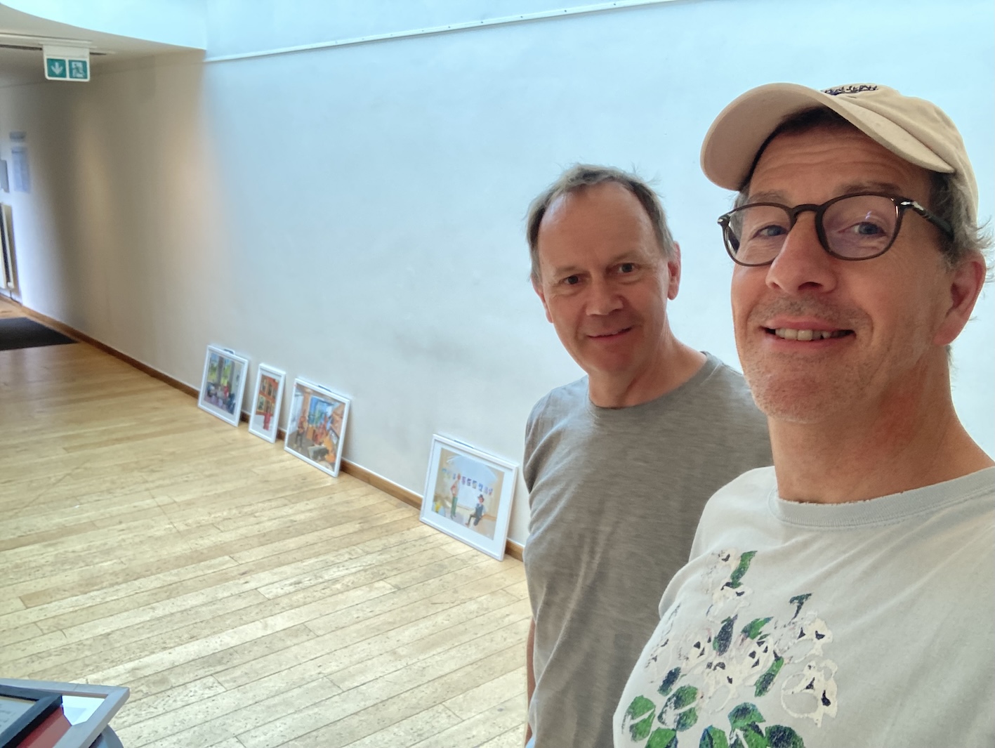 Toby and JPF in the empty gallery, four framed pictures leaning against the wall along the skirting, not yet hung Toby and JPF in the empty gallery, four framed pictures leaning against the wall along the skirting, not yet hung
