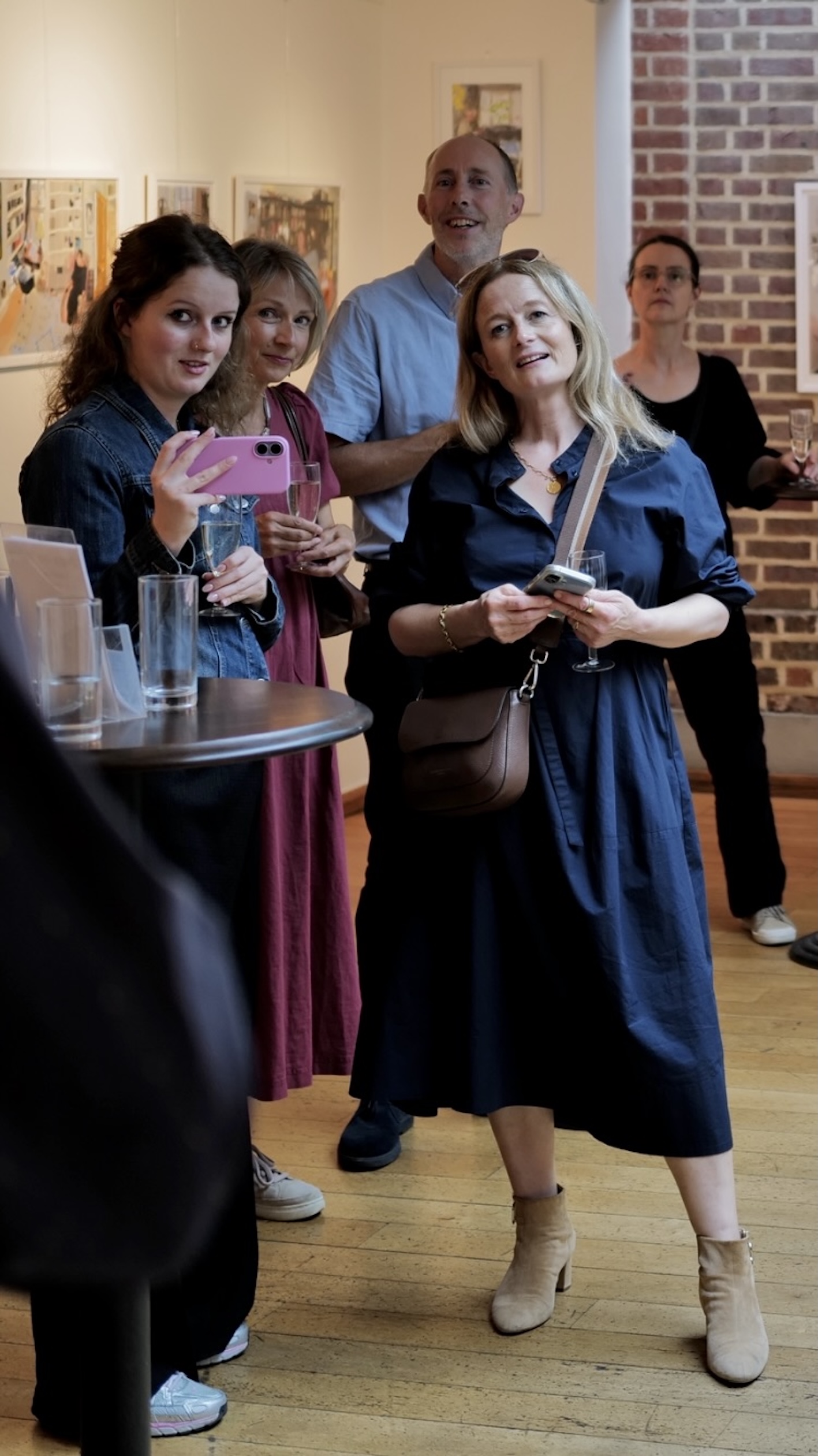 Nancy, left, and Harriet and friends listening as JPF talks at the private view, glasses in hand Nancy, left, and Harriet and friends listening as JPF talks at the private view, glasses in hand