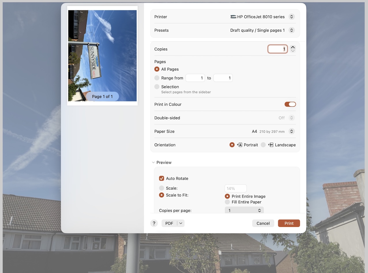 Preview's print window on a Mac with Auto Rotate ticked, and a wide photo of a Sunnyside NW2 street sign turned on its side in the page preview