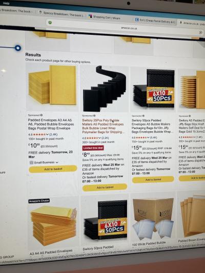 A photo of a desktop computer screen filled with padded envelope options on Amazon.